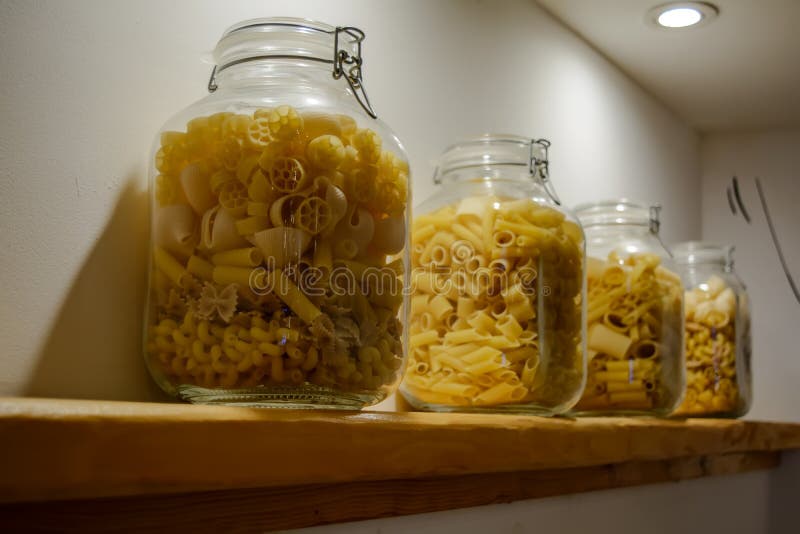 Four Glass Jars with Pasta Standing on the Shelf Stock Photo Image of
