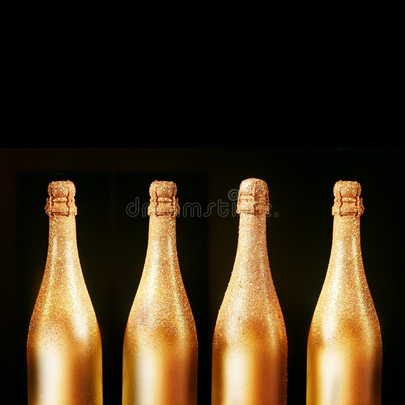 Four gold bottles of luxury champagne stock photos Four gold bottles of luxury champagne stock photos