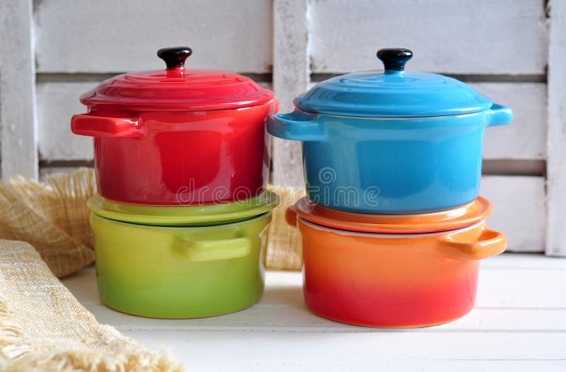 Four Little Colorful Cooking Pots and Linen Texture Stock Image Image