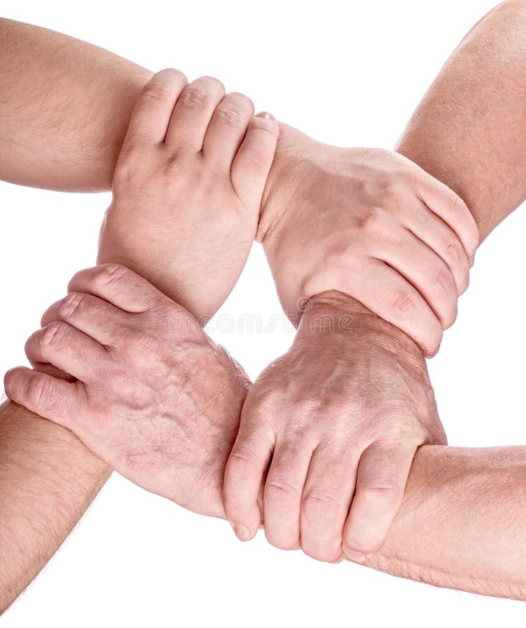 Each of the four hands is clasped around the friends wrist. One hand grips  the other, and so on. Young girls hands. Stock Photo by ©info.fotodrobik.pl  424891214