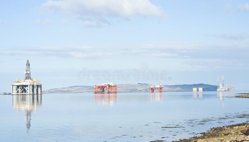 An image of four oil rigs captured within the Cromarty Firth, in North East Scotland where there are repair facilities. An image of four oil rigs captured within the Cromarty Firth, in North East Scotland where there are repair facilities.