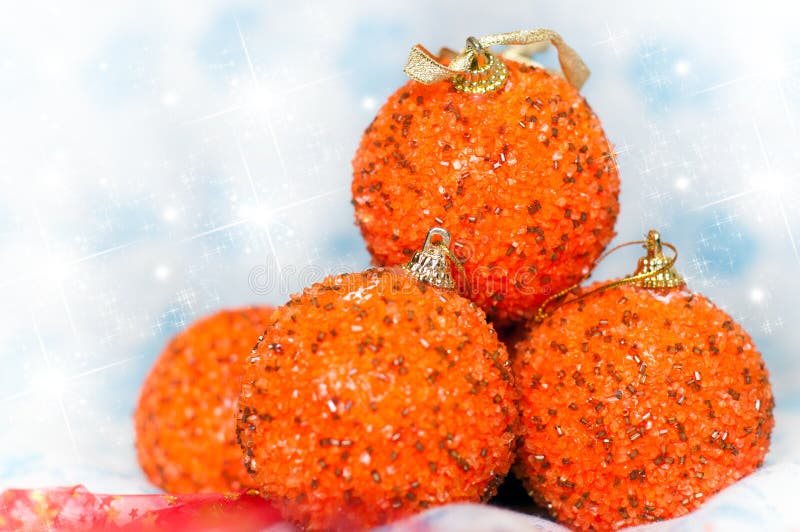 Four Orange glittering Christmas balls