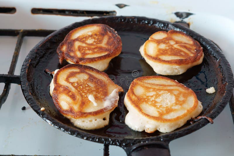 Four pancakes fried in a pan, cooking pancakes in a pan stock images Four pancakes fried in a pan, cooking pancakes in a pan stock images