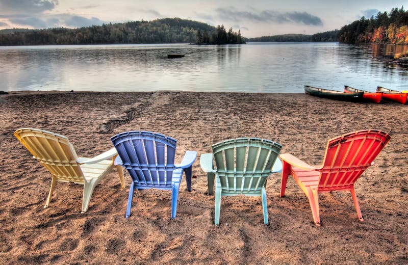 Four Patio Chairs Looking Over Lake