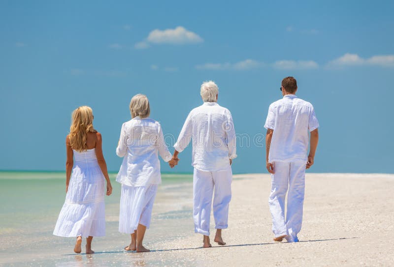 Four People, Two Seniors, Family Couples, Walking On Tropical Be stock photography Four People, Two Seniors, Family Couples, Walking On Tropical Be stock photography