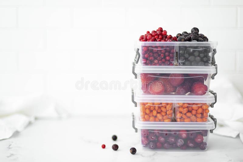 Four Plastic Containers with Frozen Berries on the White Table Stock Image Image of freezer
