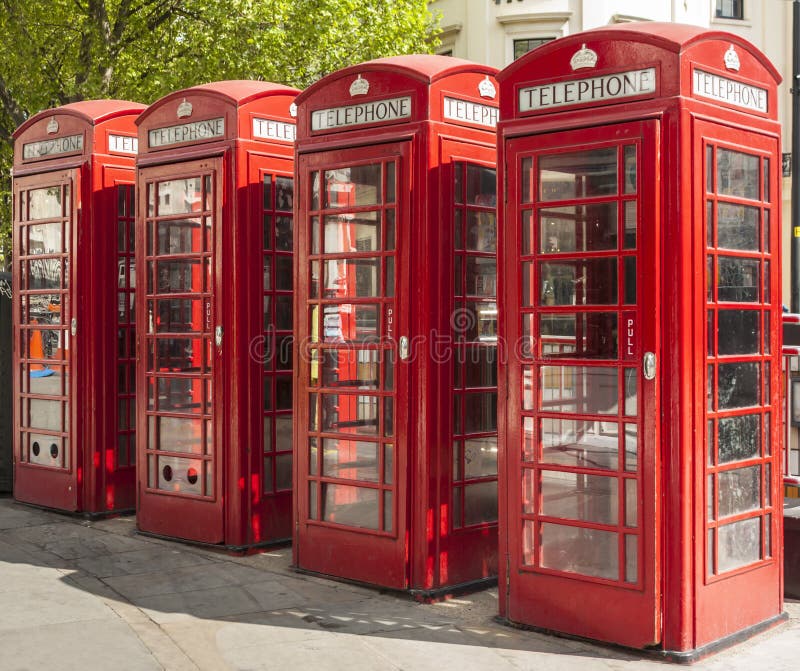 Four red telephone boxes in London