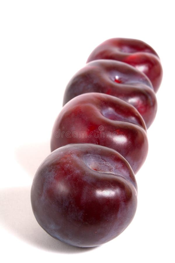 Four ripe plums