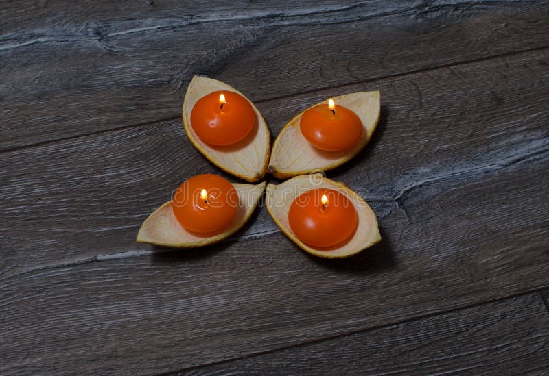 Four Round Orange Candle Burning in the Stands Stock Photo Image of