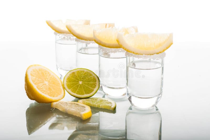 Four Shots of Vodka with Lemon Stock Image - Image of studio, glass ...