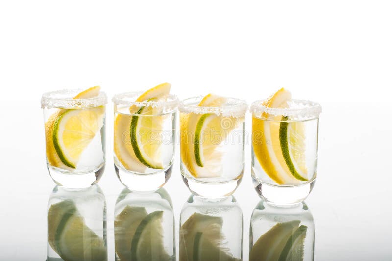 Four Shots of Vodka with Lemon Stock Photo - Image of citrus, alcohol ...