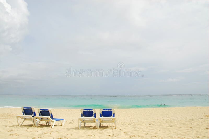 Four sun beach chairs