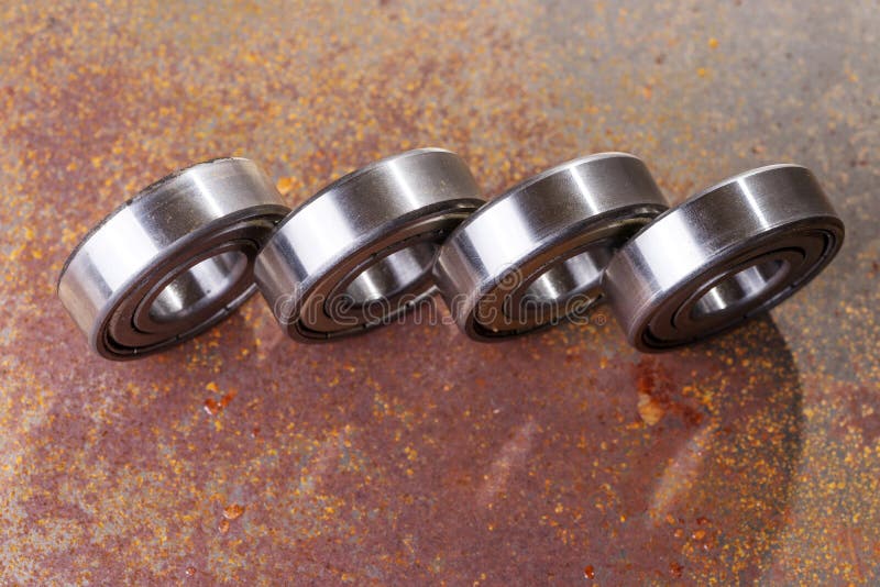 Four Metal Bearings on Rusty Surface Stock Image Image of mechanic