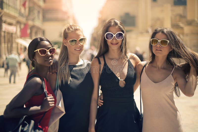Four women ont he street stock photography