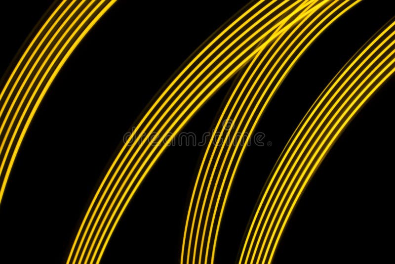 Four yellow curve and dynamic light lines on a black background. Four yellow curve and dynamic light lines on a black background
