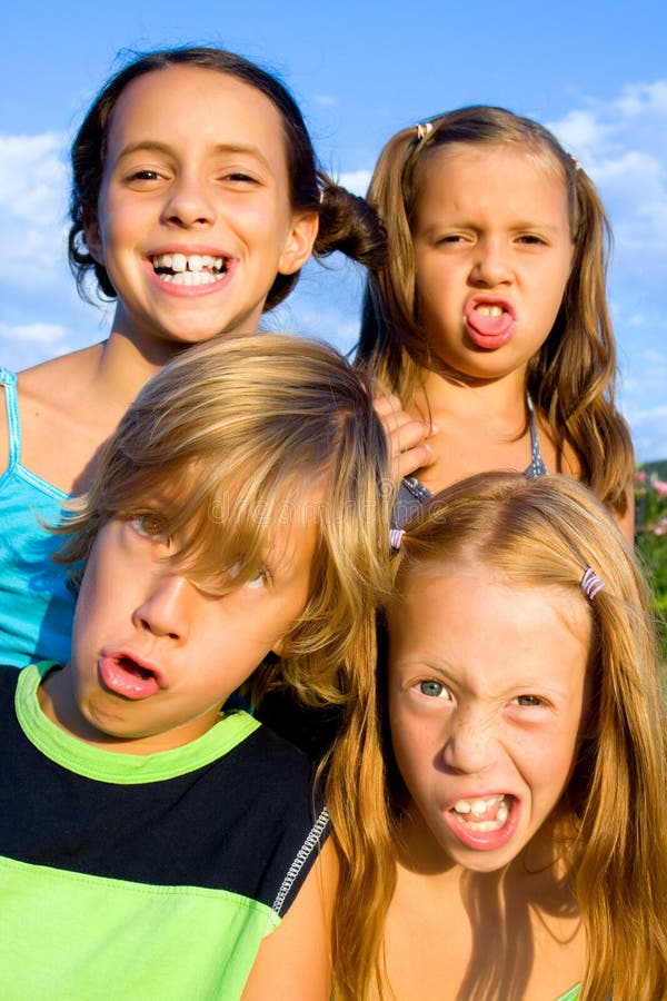 Four young beautiful kids making funny faces. Four young beautiful kids making funny faces