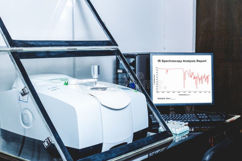 Fourier Transform Infrared Spectroscopy FTIR Instrument and IR spectrum shown on monitor