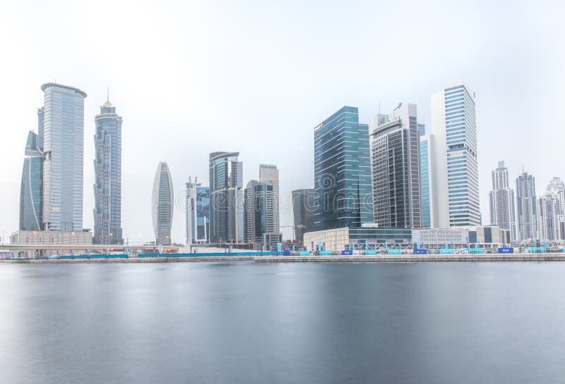 Fraction of Dubai Business Bay district skyline on a cloudy day. Dubai, UAE. stock photo Fraction of Dubai Business Bay district skyline on a cloudy day. Dubai, UAE. stock photo