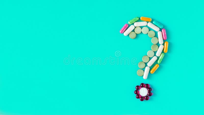 Fragezeichen gemacht von den unterschiedlichen farbigen Pillen, von den Tabletten und vom capsu stockfoto Fragezeichen gemacht von den unterschiedlichen farbigen Pillen, von den Tabletten und vom capsu stockfoto