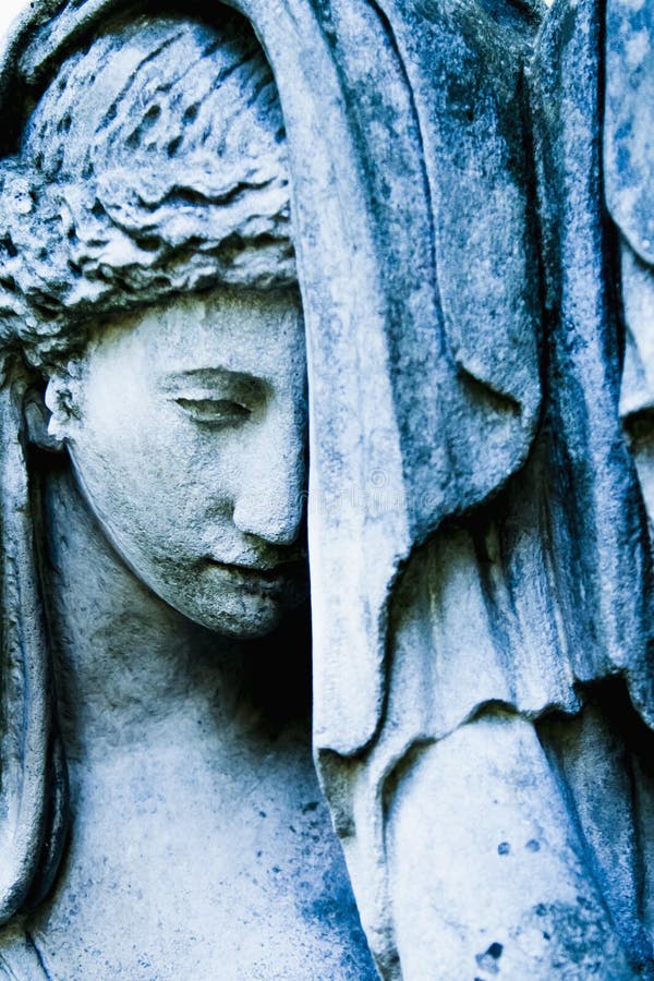 Fragment of an ancient stone statue of sad and desperate woman on tomb as a symbol of death and the end of human life. Selective