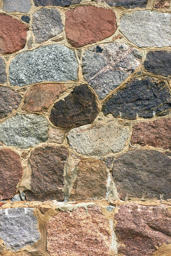 Fragment av en gammal stenvägg. gammal rockbakgrund.