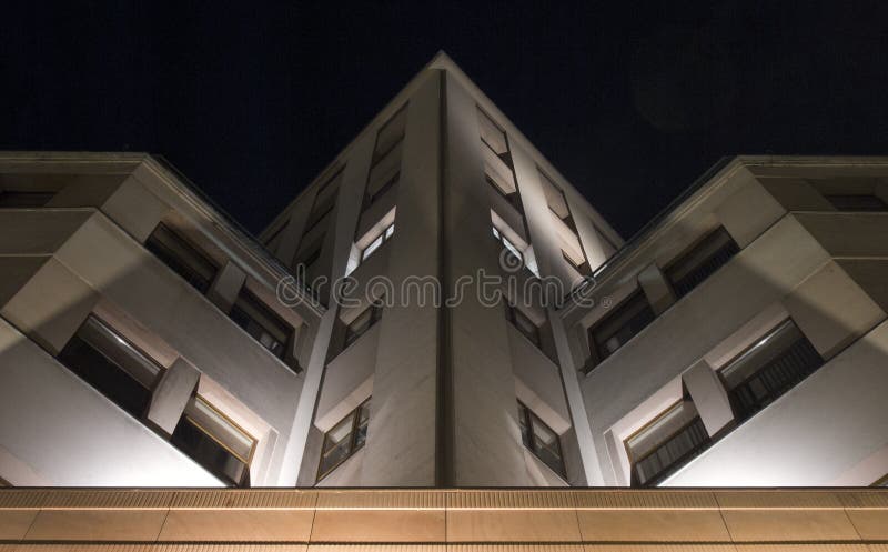 Fragment of the building illuminated night scene stock photos
