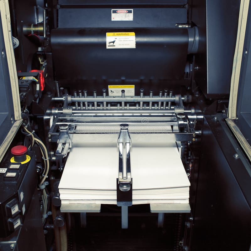 Fragment of digital offset machine with paper ready for printing stock image