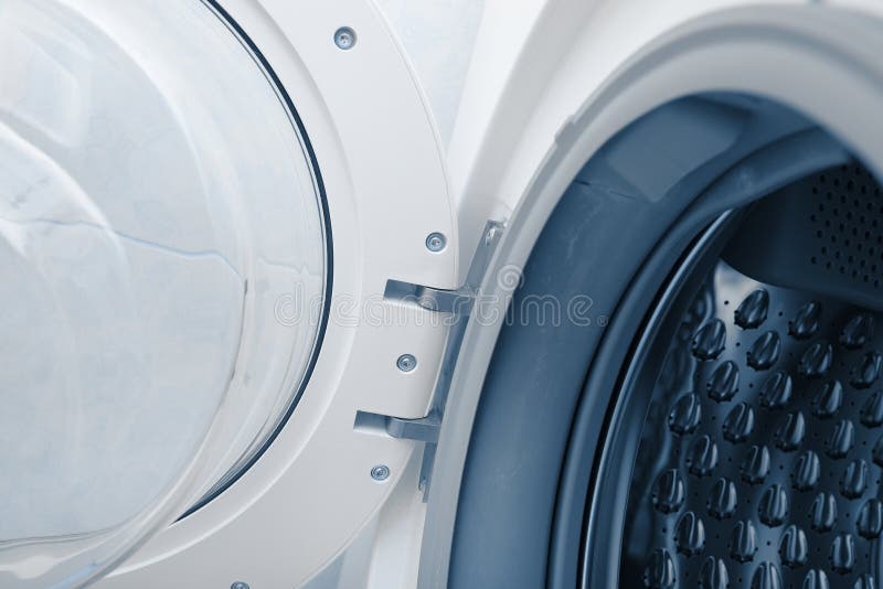 Fragment of a door and drum of washing machine stock photography