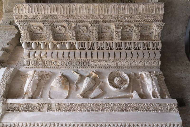 Fragment of entablature of temple of Vespasian and Titus with sacrificial instruments on frieze. Fragment of entablature of temple of Vespasian and Titus with sacrificial instruments on frieze