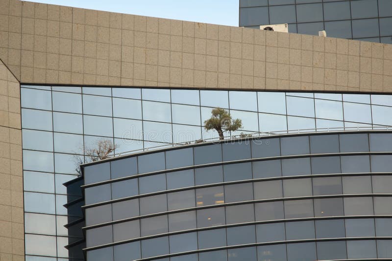 Fragment of the facade of a modern skyscraper in Tel Aviv stock images