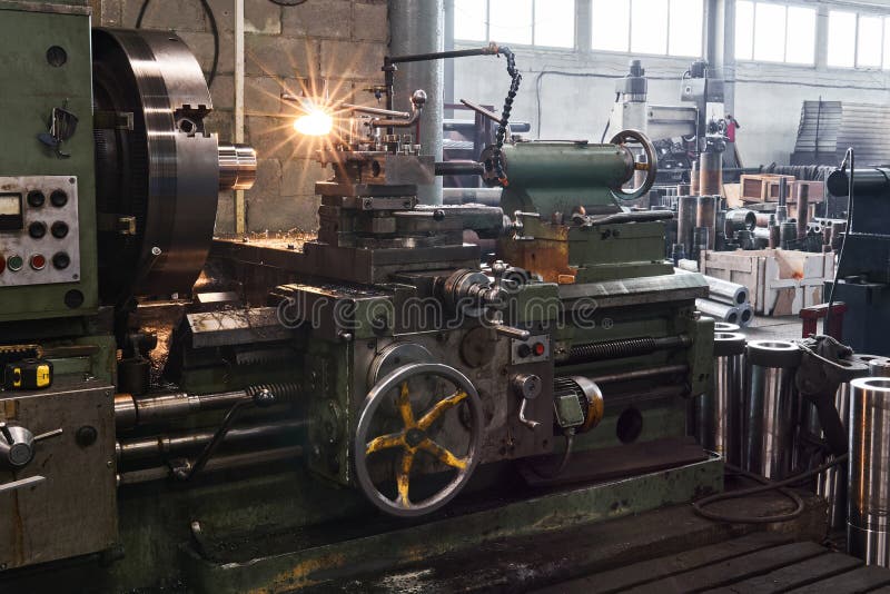 Fragment of the factory hall with a lathe in the foreground royalty free stock photos