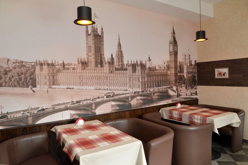 Fragment of an interior of modern cafe with the photo of the Westminster palace on a wall royalty free stock photo