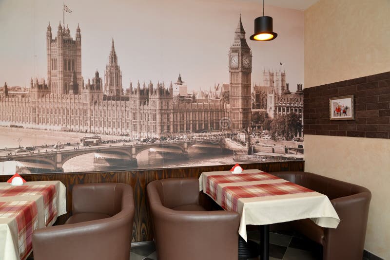Fragment of an interior of modern cafe with the photo of the Westminster palace on a wall stock photo