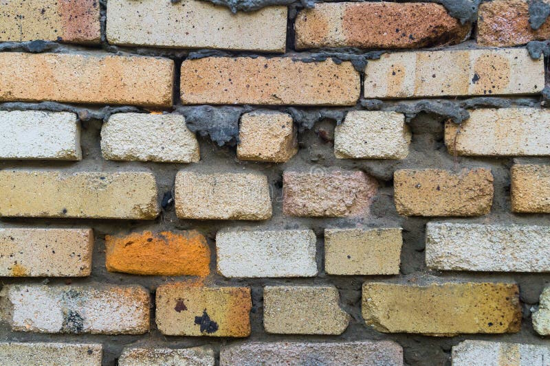 A Fragment of an Old Brick Wall in Orange Red and Yellow ,  Background Stock Photo - Image of large, pattern: 134391770