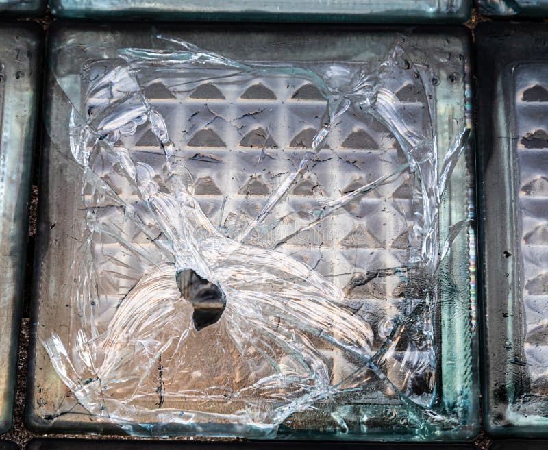 Fragment of an Old Wall Made of Cracked Blue Glass Bricks As a