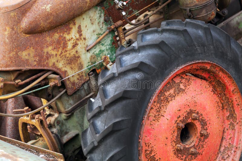 Fragment of Rusted Tractor with Red Wheel Stock Photo Image of