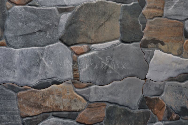 Fragment of stone wall executed from stones of various form and the size. Background image stock photos