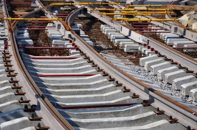 Fragment of tram rails at the stage of their installation and integration into the road. The process of laying a tramwa stock photo Fragment of tram rails at the stage of their installation and integration into the road. The process of laying a tramwa stock photo