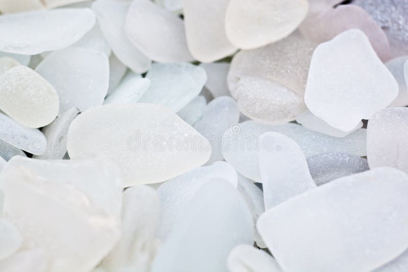 Clear and off-white glass fragments collected from a beach. Clear and off-white glass fragments collected from a beach