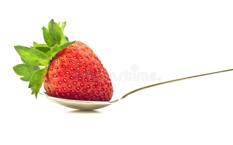 Fragola matura su un cucchiaio immagini stock libere da diritti