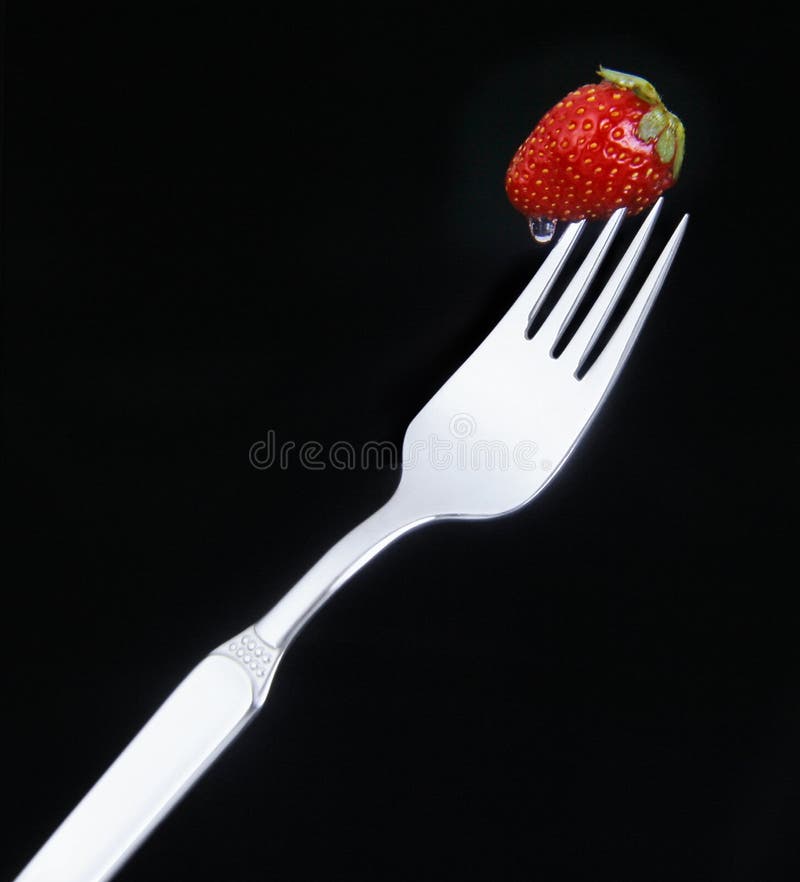 Fragola squisita su una forcella fotografia stock libera da diritti
