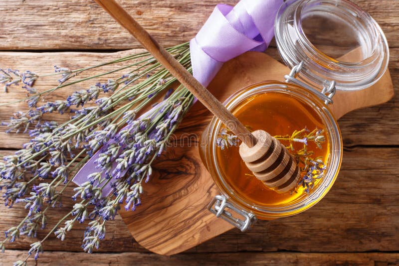 fragrant fresh lavender honey in a glass jar close-up. horizontal top view royalty free stock image fragrant fresh lavender honey in a glass jar close-up. horizontal top view royalty free stock image