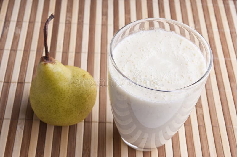 Fragrant fresh pear smoothy royalty free stock photography
