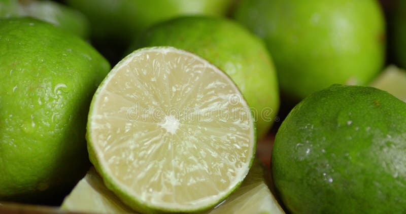 For a fragrant slice of lime falling water drops. stock video footage