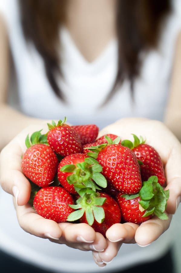 Many fresh strawberries on hand. Many fresh strawberries on hand