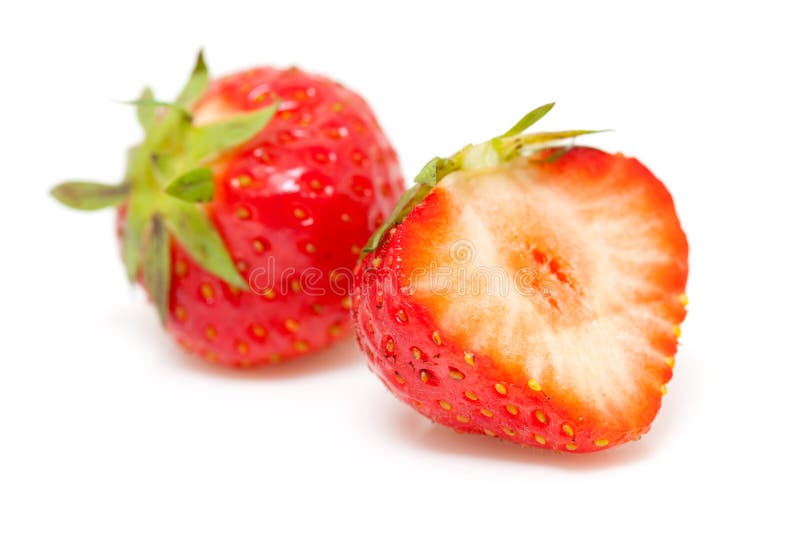 Fresh strawberries in closeup isolated on white background. Fresh strawberries in closeup isolated on white background