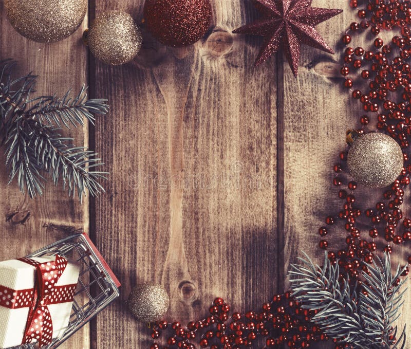 Frame with Christmas Balls, Gift and Shopping Basket on a Wooden Stock ...