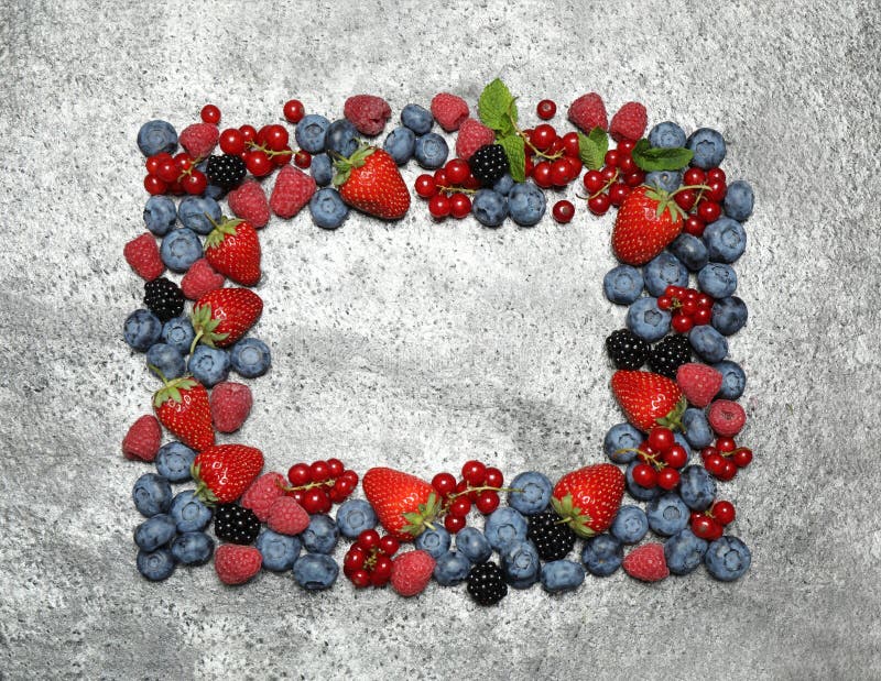 Frame of different fresh berries on background, top view. Space for text stock photos