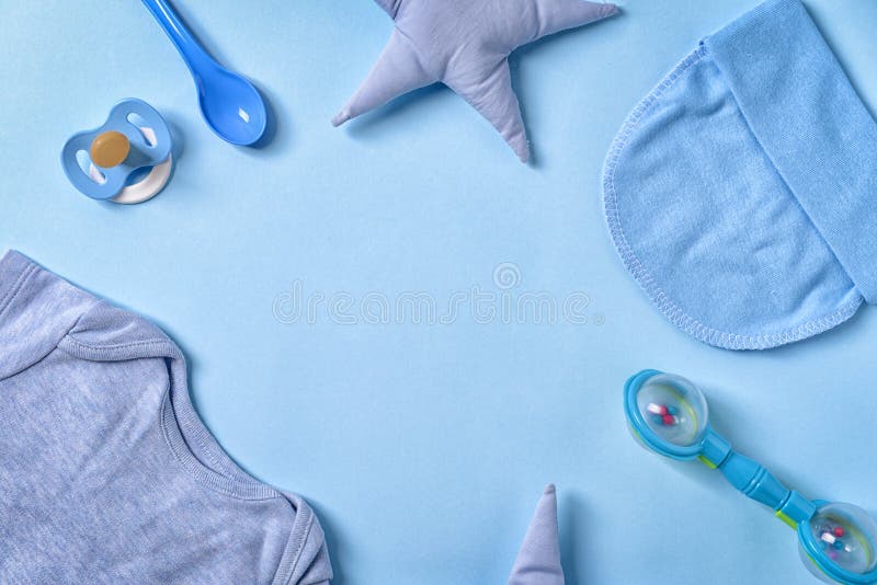 Frame Made of Baby Clothes and Accessories on Color Background, Flat