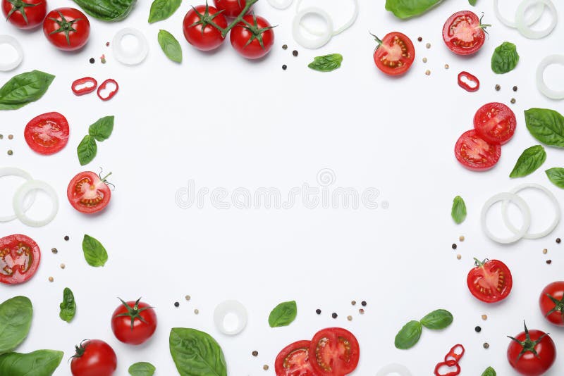 Frame made of fresh basil leaves and vegetables on white background, top view. Space for text stock photo